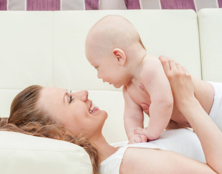 mother holding baby