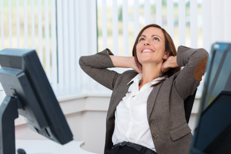 woman stretching at desk