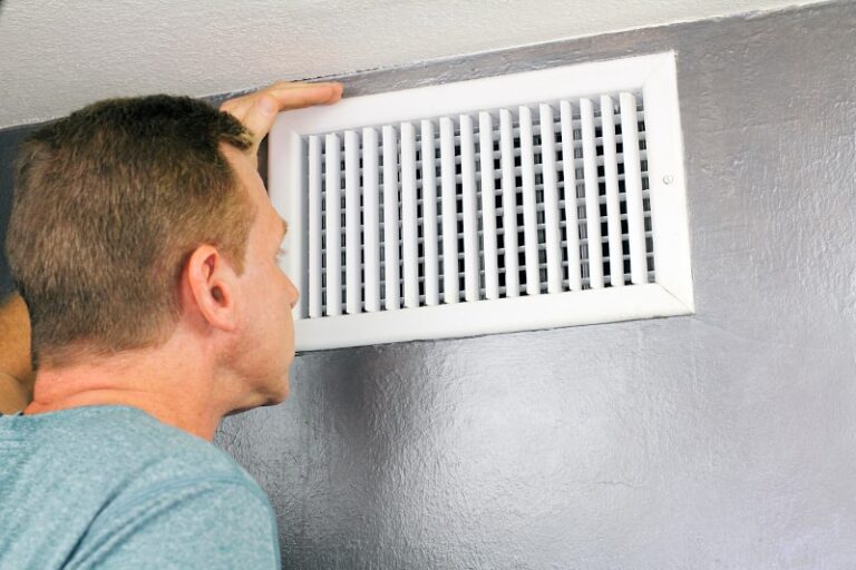 Man Checking AC Vent