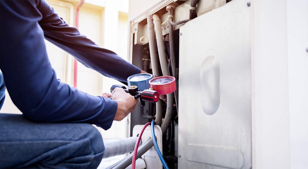 Maintenance being done on HVAC unit